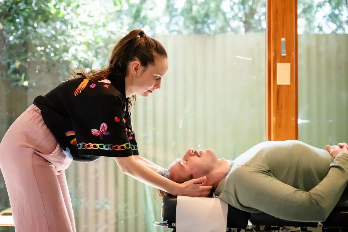 Dr Adelle Semmler adjusting a person's neck at The Chiro Crew in Kingswood