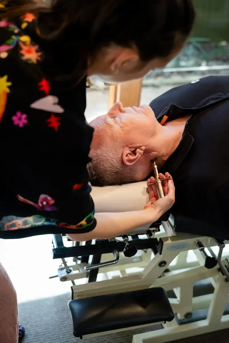 Dr Adelle Semmler checking a person's neck at The Chiro Crew in Kingswood