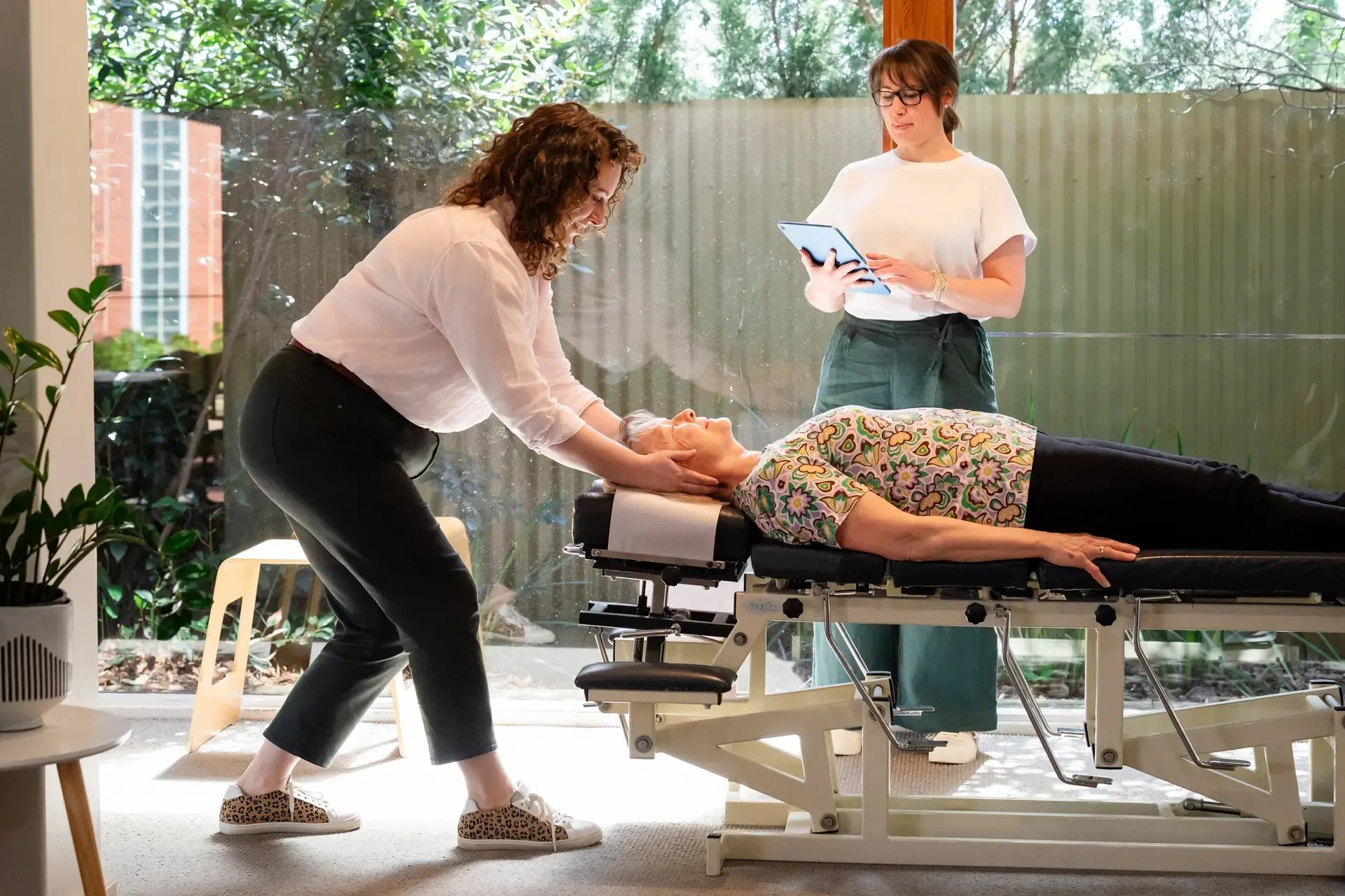 Dr Harriet Walker adjusting a person on the table at The Chiro Crew in Kingswood