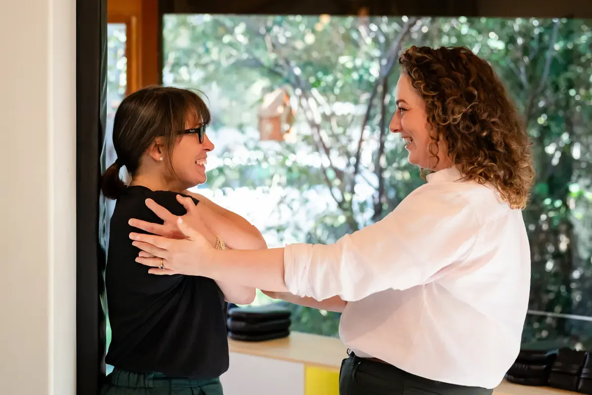 Dr Harriet Walker assessing a person's shoulders at The Chiro Crew in Kingswood